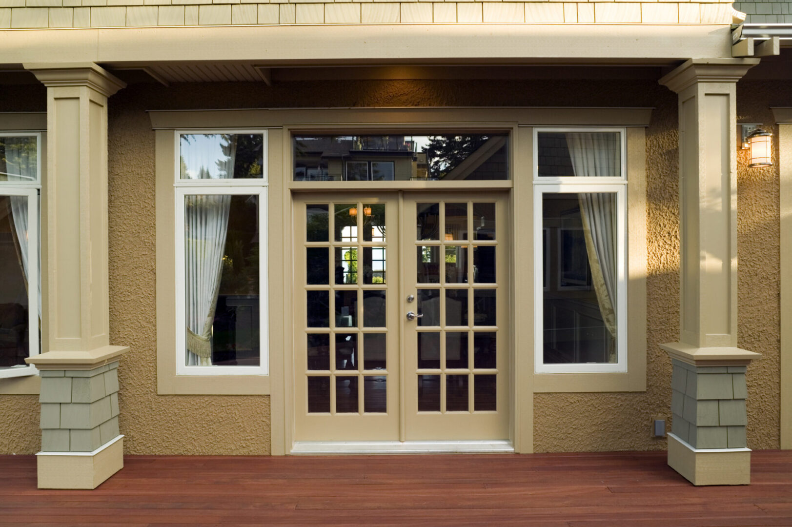 French doors with windows and curtains.