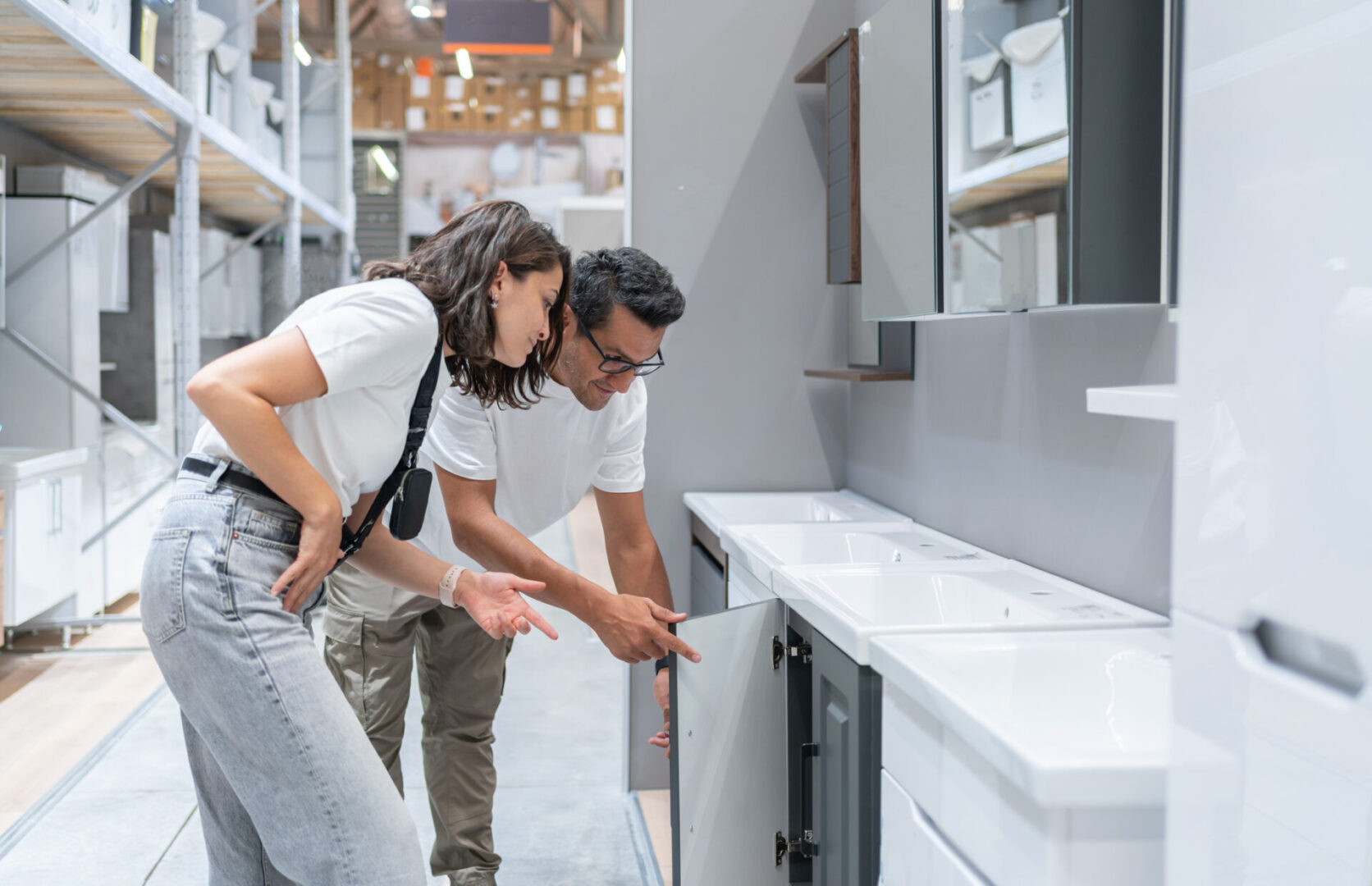 Couple Choosing Kitchen Furniture In Construction Store